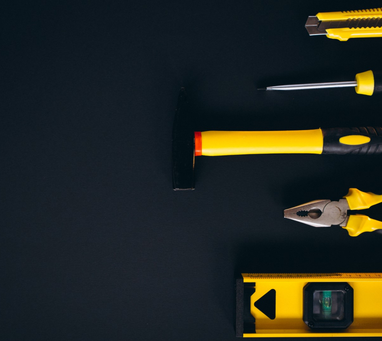 Yellow set of tools on black background